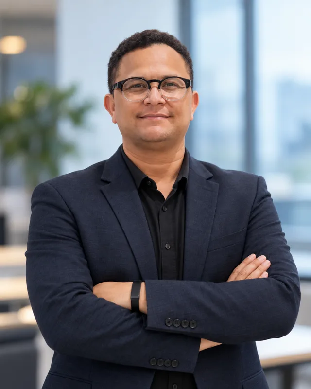 Marciano, editor of PLF Reviews, in a modern office