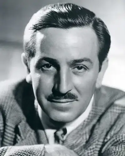 Walt Disney smiling in a suit, photographed in 1946